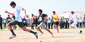Students participate in a 100-metre race during the annual sports meet of SS International School, held recently in Karnal. 