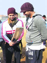 Suresh Raina and Harbhajan Singh at a session with young cricketers in Jalandhar on Wednesday