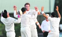 New Zealand�s Doug Bracewell (C) is congratulated by his teammates after he dismissed Sri Lankan captain Mahela Jayawardene in Colombo on Wednesday