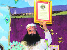 Dera Sacha Sauda chief Gurmeet Ram Rahim Singh exhibits certificate issued by the Guinness Book of World Recods at Sirsa. 