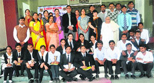 Dignitaries and participants in a moot court competition at Shanti Devi Law College in Rewari. 