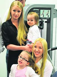 Ricky Ponting�s wife Rianna holds their daughter Emmy while Rianna�s sister Natalie (at back) holds the Pontings� second daughter Matisse at the press conference on Thursday