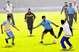 Punjab captain Mandeep Singh (centre) with the team during a training session on Friday.