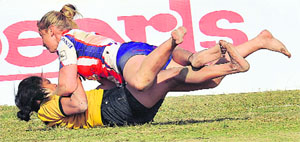 England, Malaysia eves slug it out during a match at the MR Government College Stadium, Fazilika on Sunday.