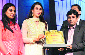 Karisma Kapoor, ambassador of Avalon Group, felicitates the awardees during a function in Gurgaon.
