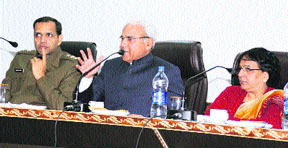 The Haryana Lokayukta, Justice Pritam Pal (centre), flanked by Additional Deputy Commissioner Sumedha Kataria (right) and district police chief Rakesh Arya (left), addresses elected representatives of the Panchayati Raj, district officers and mediapersons at the conference hall of Panchayat Bhawan, Kurukshetra. 