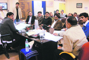 Officers of Jhajjar and DMRC discuss rail projects at a meeting in Jhajjar.