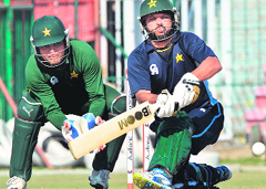 Shahid Afridi sweeps during a training camp in Lahore on Wednesday. � AFP