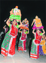 Artistes from Khandwa (MP) perform Madhya Pradesh�s folk dance �Nimar Gangaur� at the inaugural function of Geeta Jayanti on the banks of Brahamsarovar in Kurukshetra.