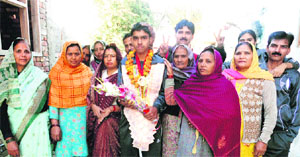 Ashish along with his family members at Bahadurgarh town in Jhajjar. 