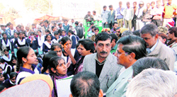 SDM GL Yadav talks to agitating girl students at Naiwali Chowk in Rewari.