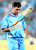 Indian skipper M S Dhoni returns to the pavilion after his dismissal during the 1st T20 match against Pakistan in Bangalore on Tuesday