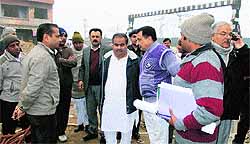 Sonepat MP Jitender Singh Malik interacts with PWD officials to know about the progress in the construction of an RoB at a level crossing near Sonepat railway station