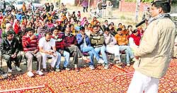 INLD leader Satish Yadav addresses a protest rally at Dharuhera in Rewari District
