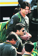 Mohammad Irfan and other Pakistan cricketers on their arrival at the airport in Kolkata on Monday; Shoaib Malik (top). � PTI 