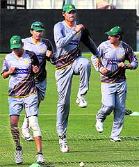 Mohammed Irfan (centre) trains along with teammates at the Eden Gardens; Rohit Sharma and Suresh Raina (left) arrive in Kolkata on Tuesday
