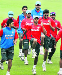 The Indian team warms up before practice at the Eden Gardens in Kolkata on Wednesday. 