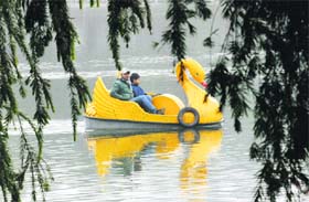 People enjoy boating on the New Year day at Karna Lake in Karnal. 