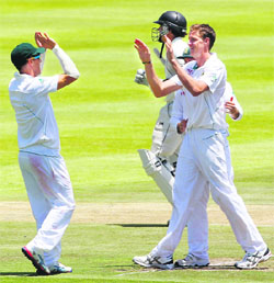 Morne Morkel celebrates the wicket of Dean Brownlie (background) on Friday.