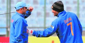 Under-fire opener Virender Sehwag trains with skipper MS Dhoni at Ferozeshah Kotla on Sunday.
