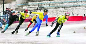 Participants taking part in speed skating during 'Mathasports' IX Ice Skating National Championship-2013 in Shimla.