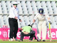 A Sachin fan gives him a godly treatment during the quarterfinal match at the Wankhede Stadium