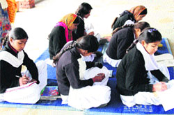 Students of Government Senior Secondary School in Model Town sit on the floor while attending classes. Photo: Manoj Dhaka