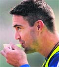 Kevin Pietersen warms up with tea on a cold day in New Delhi.