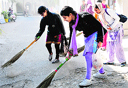 NSS volunteers of the Government College for Women take part in a cleanness drive in Karnal