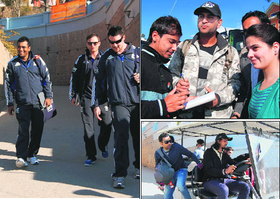 England team players, delighted on ending the tour on a high, leave the team hotel; Indian captain MS Dhoni (above right) also had much to be cheerful about as India reclaimed the No. 1 ranking in One-day cricket; Ishant Sharma (right) takes charge of the wheel as they leave the team hotel in Dharamsala on Monday. 