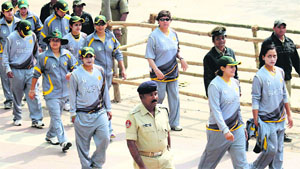 Pakistan�s women cricketers being escorted to the stadium at Cuttack for nets. 