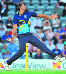 Gurinder Sandhu, whose family roots are in Faridkot, bowls for the Australian Prime Minister�s XI during their match against the visiting West Indians in Canberra on Tuesday. The hosts won by 23 runs