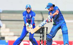 Harmanpreet Kaur plays a shot on her way to century (107*) during the India- England Women's World Cup match in Mumbai on Sunday.