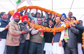 Naveen Jindal (in garland), MP, Kurukshetra, and Deepender Hooda, (wearing spectacles), MP, Rohtak, are welcomed at Sarsa village