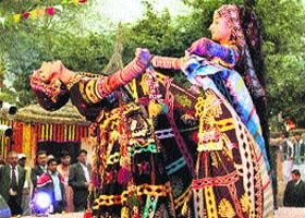 Artistes perform during the ongoing 27th Surajkund International Mela at the picturesque mela complex in Surajkund