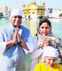 President Pranab Mukherjee's son Indrajit Mukherjee and his wife Sugandhi pay obeisance at the Golden Temple in Amritsar on Thursday