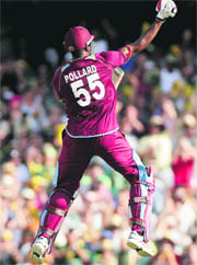 Kieron Pollard celebrates his century, but the day did not end happily for his team.