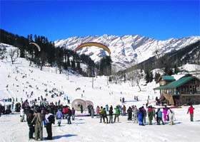 Paragliding, zorbing go hand-in-hand at Solang valley after a surprise snowfall on Sunday