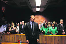 Oscar Pistorius awaits the start of the court proceedings on Tuesday.