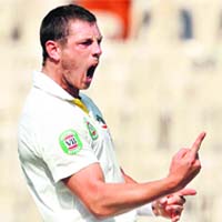 Australia�s James Pattinson celebrates the wicket of Cheteshwar Pujara