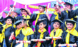 Children hold their certificates at the annual prize distribution held at a school in Patiala on Sunday