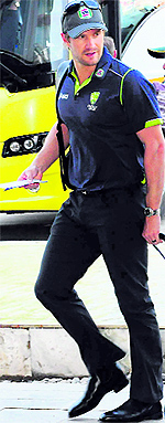 Shane Watson checks in at the team hotel in Chandigarh