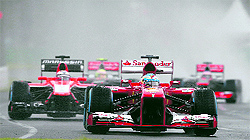 Ferrari�s Fernando Alonso of Spain (front) drives during the qualifying session of the Australian F1 Grand Prix at the Albert Park circuit in Melbourne on Saturday