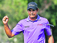 Gaganjeet Bhullar celebrates a birdie putt during his round of 64 at the Avantha Masters