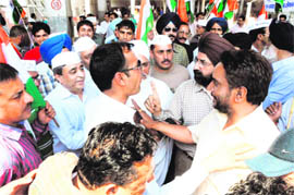 Supporters of Anna and Aam Aadmi Party arguing with each other at the Amritsar Railway Station on Saturday.