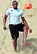 Usain Bolt plays foovolley at Copacabana beach in Rio de Janeiro on Saturday