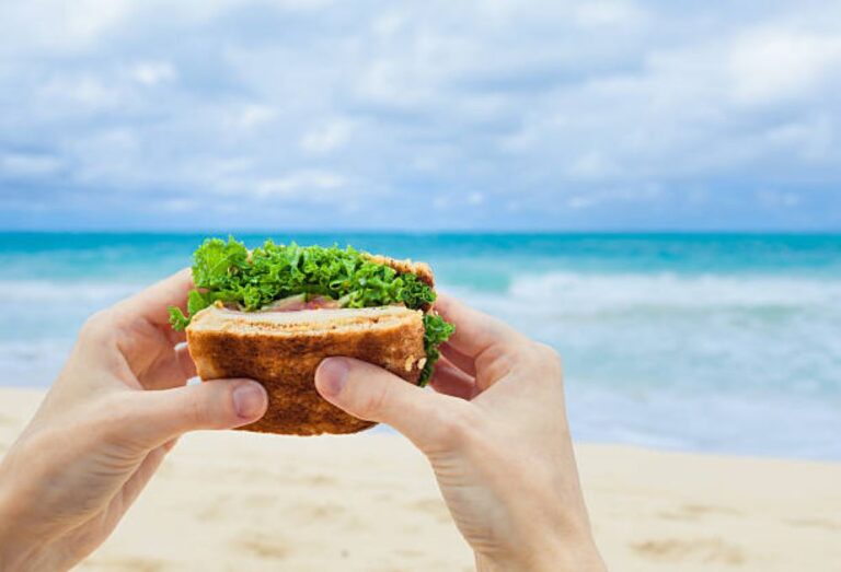 eating healthy in los cabos sandwich at the beach