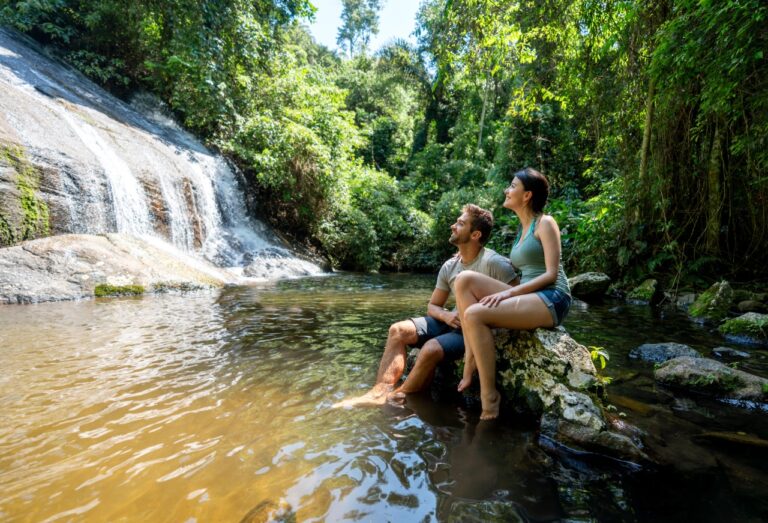 true ecotourists enjoying a waterfall