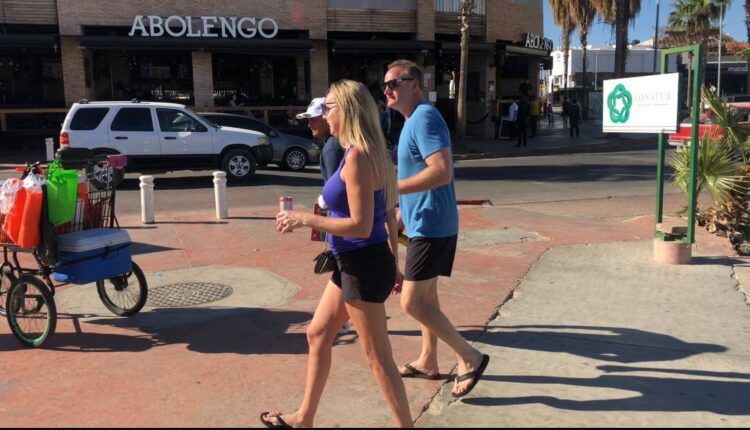 tourists strolling by los cabos streets