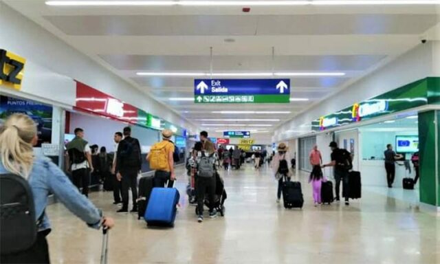 passengers at cancun airport for day of the dead